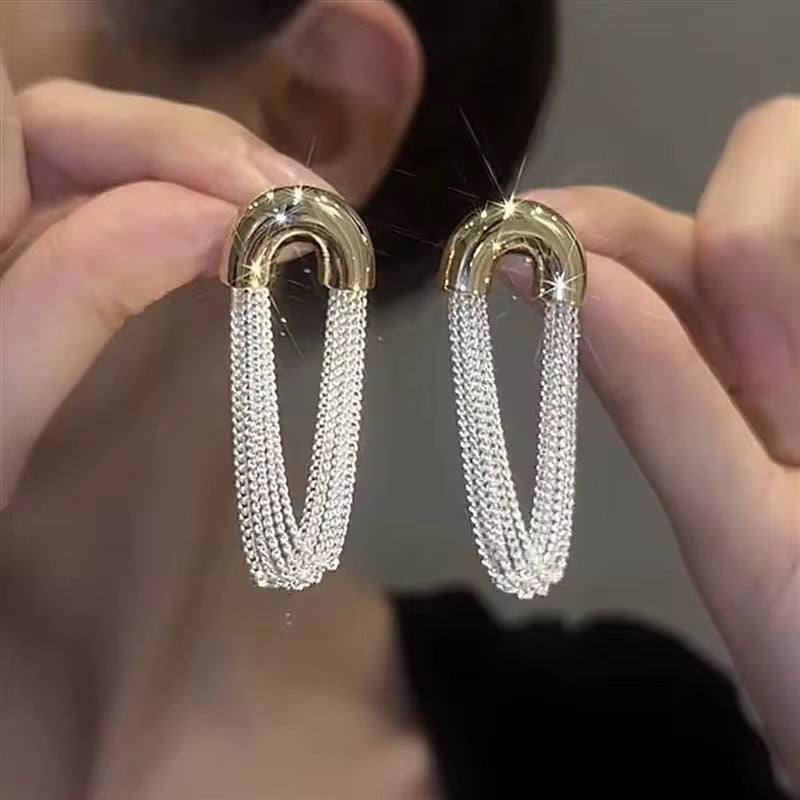 Oval curved metal chained earrings