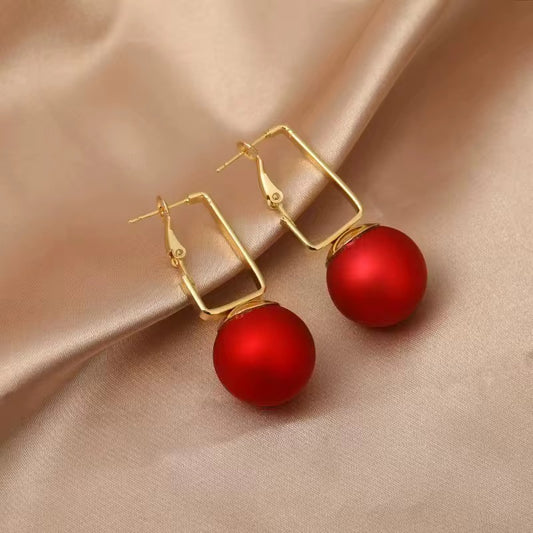 Red big pearl pendant earrings
